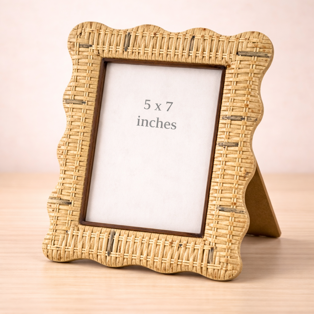 Woven wicker photo frame on wood